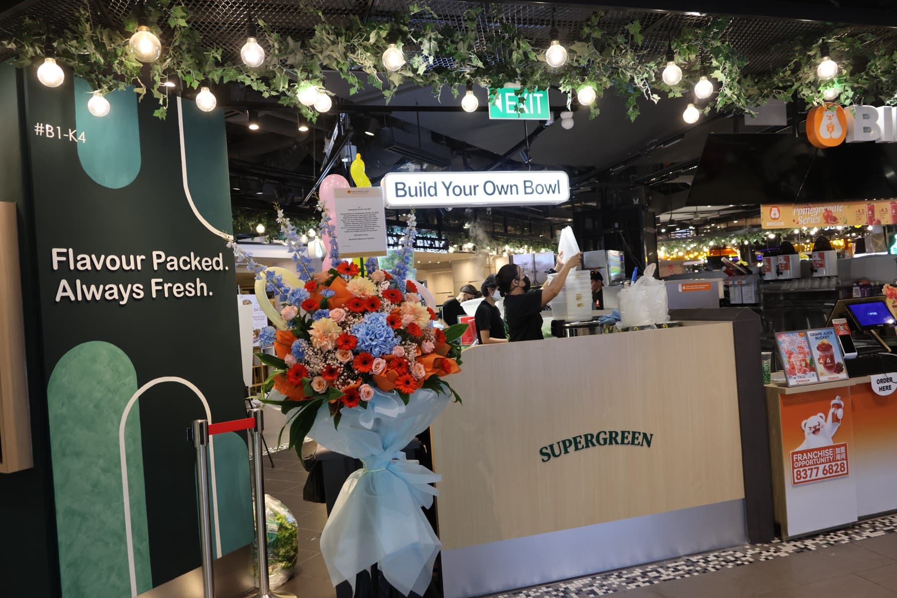 Opening day flower stand at the Supergreen Suntec City outlet